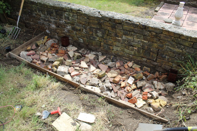 Filled The Dug Out BBQ Area With Rubble Before Pouring In The Concrete