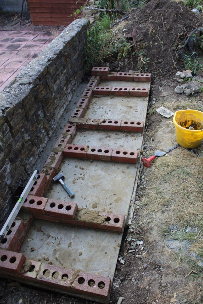 First Rows Of Bricks Laid For The Barbecue