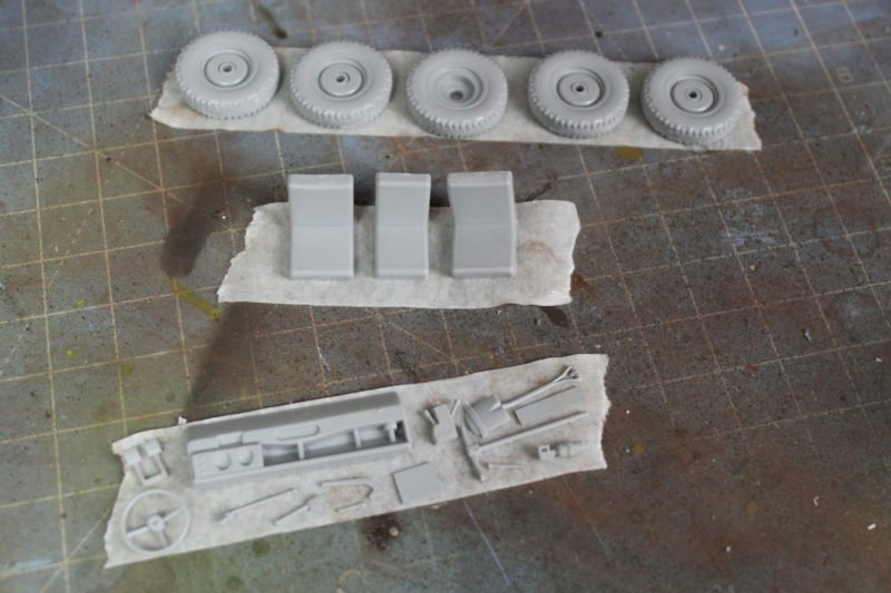 Small Parts Of The Land Rover Model Stuck To Masking Tape Ready For Undercoating