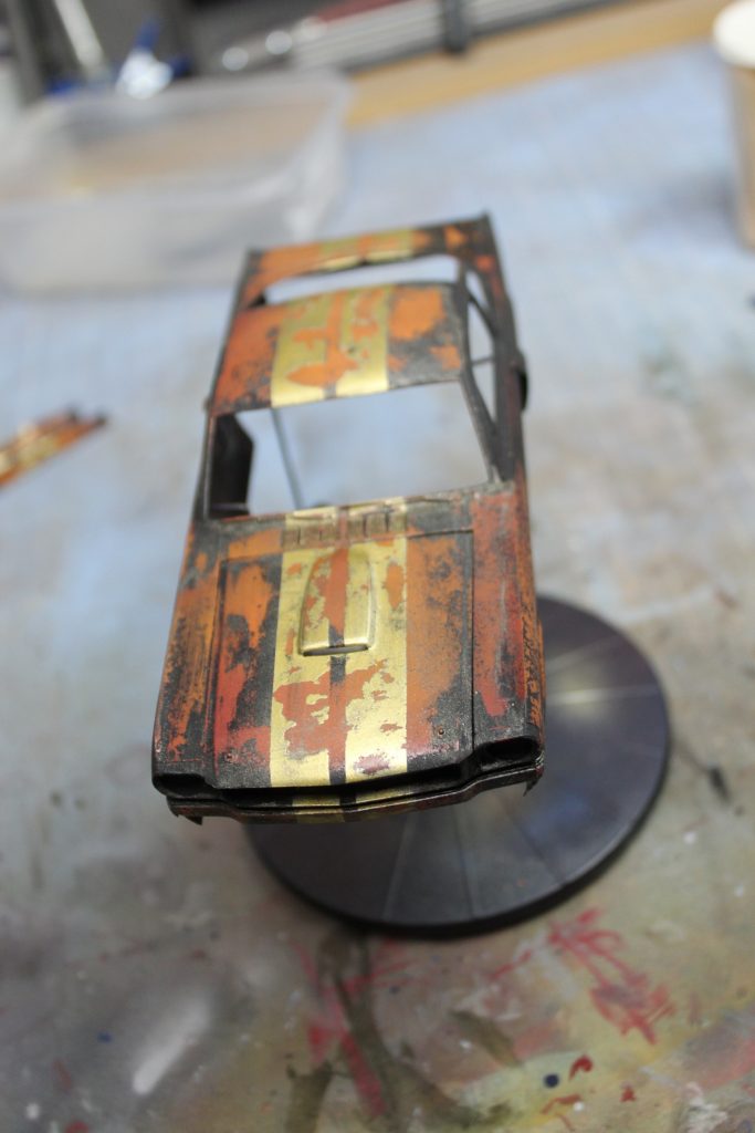 Top Layers Of Paint Removed From The Monogram Mustang Model To Reveal The Rusty Body